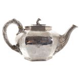 Irish crested silver tea pot of bulbous chamfered form with engraved leaf scroll and cross hatched