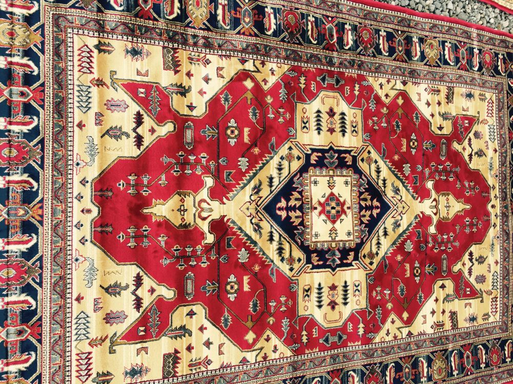 Kashmir rug with Aztec design on red ground Worldwide shipping available: shipping@sheppards.ie