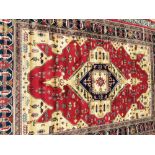 Kashmir rug with Aztec design on red ground Worldwide shipping available: shipping@sheppards.ie