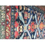 Caucasian rug vegetable dye, navy ground with red border Worldwide shipping available: shipping@