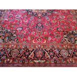 Handmade North East Persian carpet fine carpet weaving, including weaver's signature, on rich red