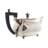 Silver teapot of rectangular baluster form, with a  gadrooned border. Chester 1927 Worldwide