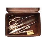 Nineteenth-century leather cased necessaire complete with silver handled manicure set Worldwide