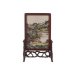 Chinese Qing period famille vert table screen depicting figures in an extensive river and mountain