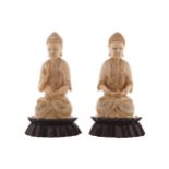 Pair of Qing period ivory Buddha each raised on a hardwood stand Worldwide shipping available. All