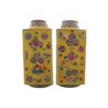 Pair of Chinese Qing period famille jaune vases each of square form with polychrome decoration and