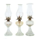 Reserve: 200 EUR        3 Petroleum-Lampen Portugal, um 1900/20, klares Pressglas, davon 1 Paar