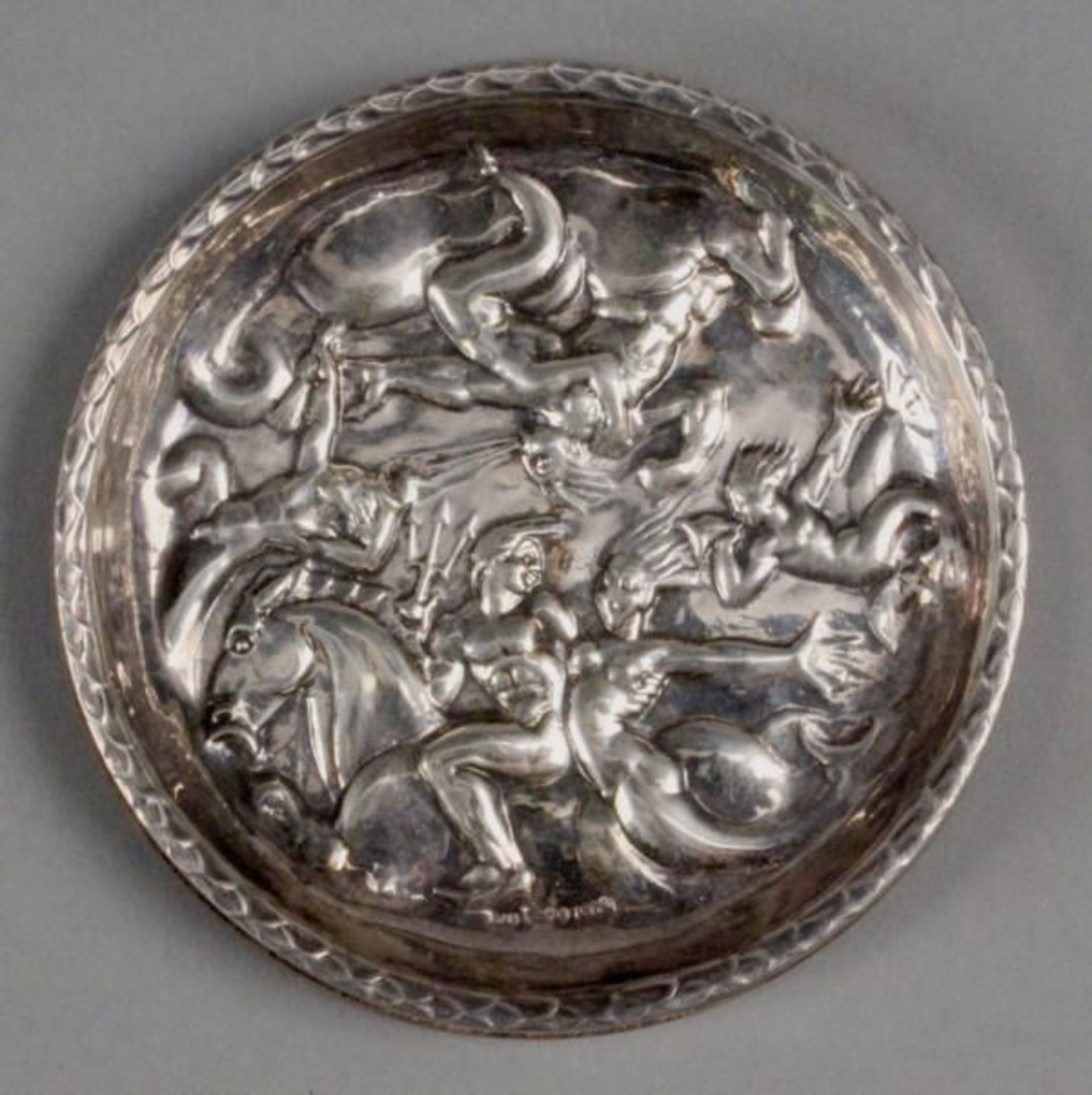 A BOTTLE COASTER Sweden, 20th century Silver with antique representation of Gods in the relief,