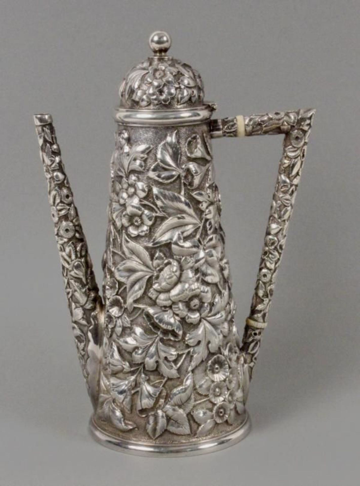 A MOCHA POT John Mason, New York ca. 1890 925 Sterling silver, tapered shape with all-round floral