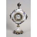 A PROCELAIN CLOCK ca. 1900 Round porcelain case with coloured painted flower bouquet and gold decor,