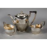 A TEA SERVICE Sweden, 1920 Silver, a 3-piece service in the Regency style monogrammed with: PSO;