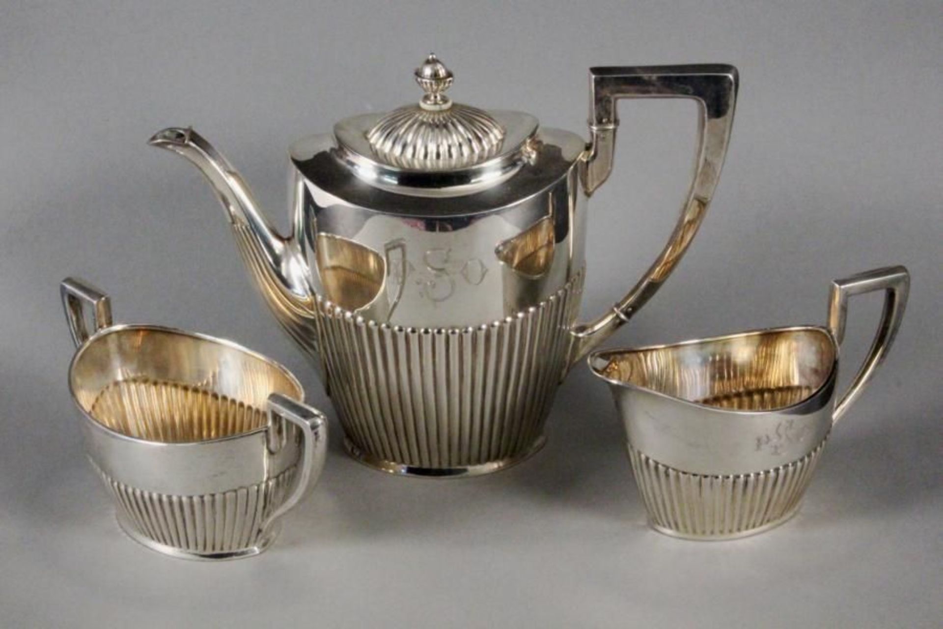 A TEA SERVICE Sweden, 1920 Silver, a 3-piece service in the Regency style monogrammed with: PSO;