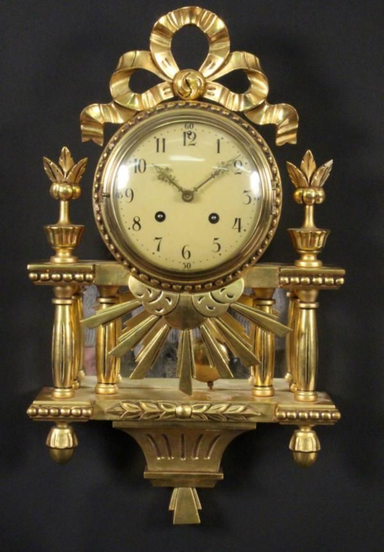A CARTEL CLOCK Sweden Gilt wooden case of Rococo style, pendulum with striking the hours on a