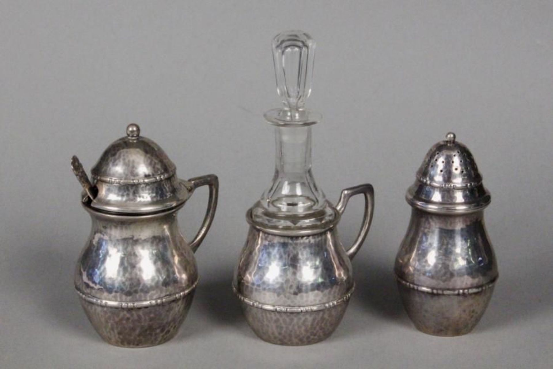 AN ART DECO SET FOR SPICES Sweden Silver, hammered decoration, with original glass inserts, 3