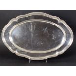 Opening: 500 EUR    A SERVING PLATE German 800 Silver, scalloped oval shape with profiled border,