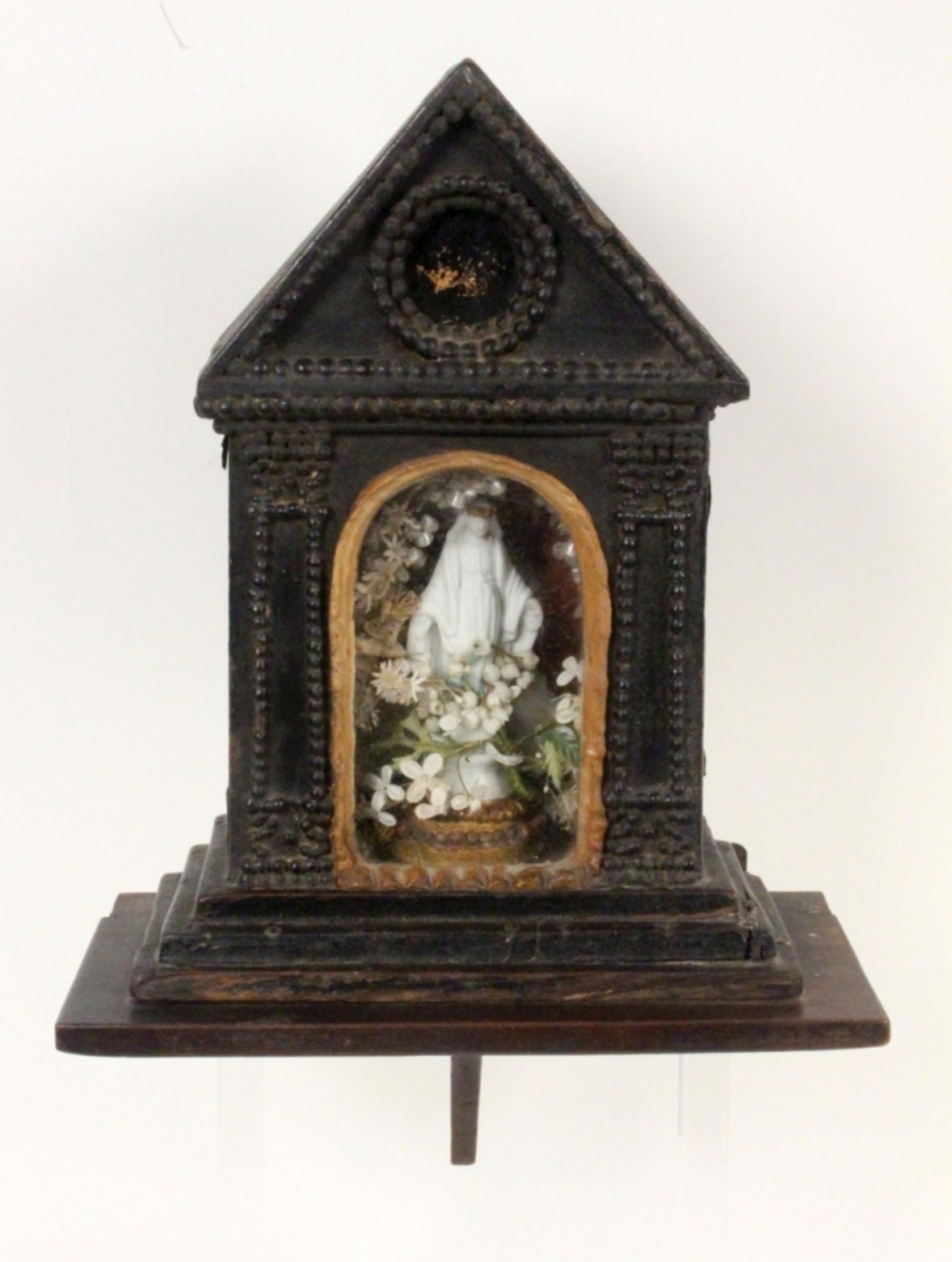 Opening: 150 EUR    A RELIQUARY BOX 19th century A standing shrine with glassed front on a