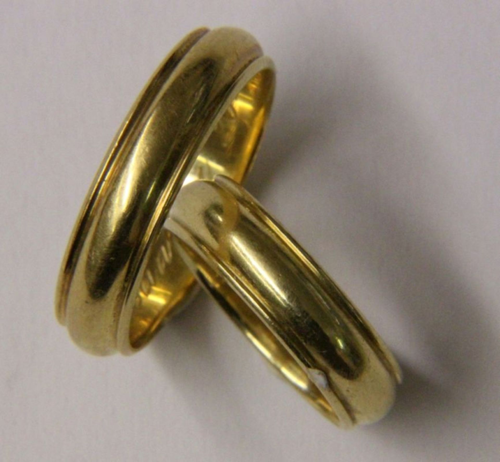 PAAR EHERINGE750/000 Gelbgold. zus. ca. 15,7gAufrufpreis: 380 EUR

2x 18CT GOLD WEDDING