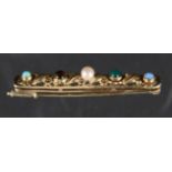 ANSTECKNADEL / BROSCHE585/000 Gelbgold mit Perle, 2 Opalen, Smaragd und Tigerauge. L.4,8cm, ca. 5,