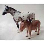 A Beswick pottery Appaloosa Stallion, standing, facing left model 1742B and a Beswick pottery