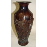 A Japanese Meiji bronze Vase of baluster form with everted rim, cast in relief with immortals and