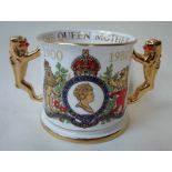 A large Paragon china limited edition two-handled Loving Cup with gilt lion handles, commemorating