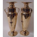 A good pair of brass Arts and Crafts two-handled Vases, of baluster form with flared rim above