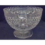 A large Stourbridge Tudor heavy cut glass Pedestal Bowl of typical circular form, castellated rim,