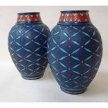 A pair of Mettlach Vases of ovoid form with narrow necks, incised decoration of floral sprigs and
