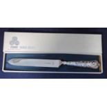 A late 20th century silver handled Cake Knife by Viners of Sheffield, with foliate embossed handle