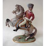 A Capodimonte porcelain Figural Group depicting a cavalry officer on horseback, the horse rearing on