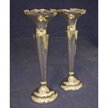 An early 20th century pair of silver Posy Holders of tapering canted square form, circular trumpet