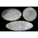 A collection of forty-seven early 19th century mother of pearl gaming counters, each engraved with