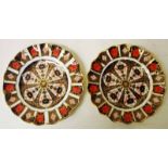 A pair of late 20th century Royal Crown Derby scallop edge plates, decorated in the Imari pattern,