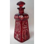 A Bohemian ruby glass decanter of square tapering form, compressed shoulder, narrow neck with