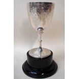 A Victorian silver trophy of chalice form with slender knopped stem and spreading circular foot,