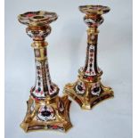 A large pair of late 20th century Royal Crown Derby candlesticks, decorated in the Imari pattern,