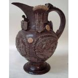 A late 19th century Essex Jug by Edward Bingham, chocolate sprigged brown pottery, cream wheat