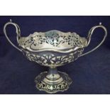 An Edwardian silver two-handled pedestal bon bon bowl of circular form, shaped rim, body and foot