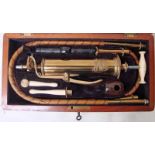 Arnold and Sons West Smithfield London, a cased late 19th century brass and ivory medical syringe