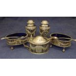 A George VI five-piece pierced silver condiment set, the two pepperettes of classical urnular