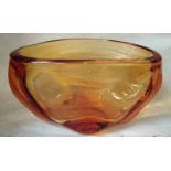 A Whitefriars amber glass vase of oval free form with quatrefoil base, 29cm long