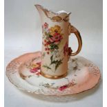 A Royal Worcester jug vase of tusk form, painted flower sprays on a blush ivory and gilt highlighted