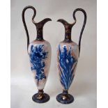 Doulton Burslem, a pair of ewers of classical style decorated with transfer printed flowers,