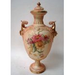A late 19th century Royal Worcester twin handle vase and cover of ovoid footed form, decorated