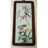 A set of four Chinese hardwood framed porcelain plaques of rectangular form, hand painted in