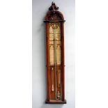An Admiral Fitzroy forecasting barometer of typical form in a Gothic style arch top light oak case