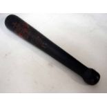 A George IV ebonised short hardwood truncheon of tapering form with gilt and painted cypher and