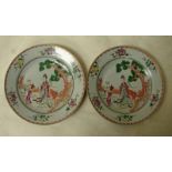 A pair of Chinese Famille Rose porcelain plates decorated in polychrome enamels with figures and a