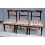 A set of six William IV mahogany dining chairs, scrolled top rail, ribbed horizontal centre splat,