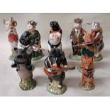 A Beswick pottery nine piece Pig Band including John, James, Matthew, Daniel, Andrew, Christopher,